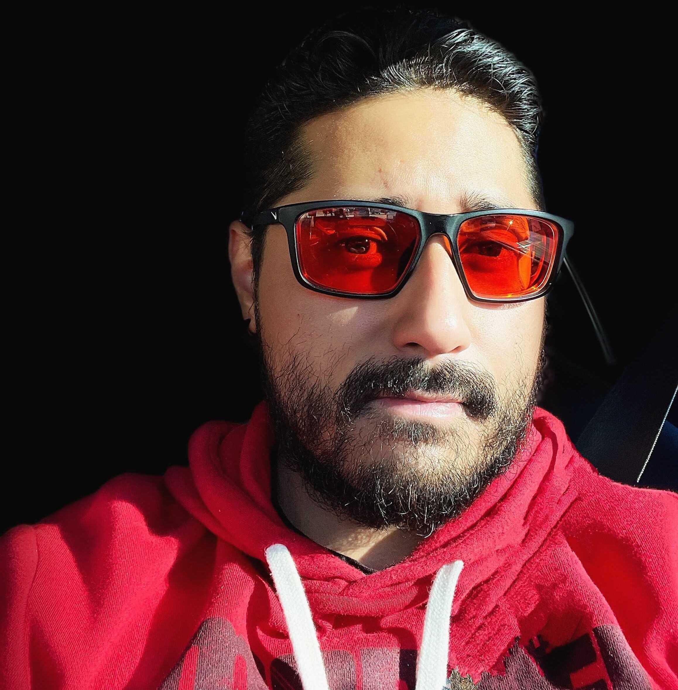 img_0493~2 - Carlos Sosa Photo of a guy in red glasses